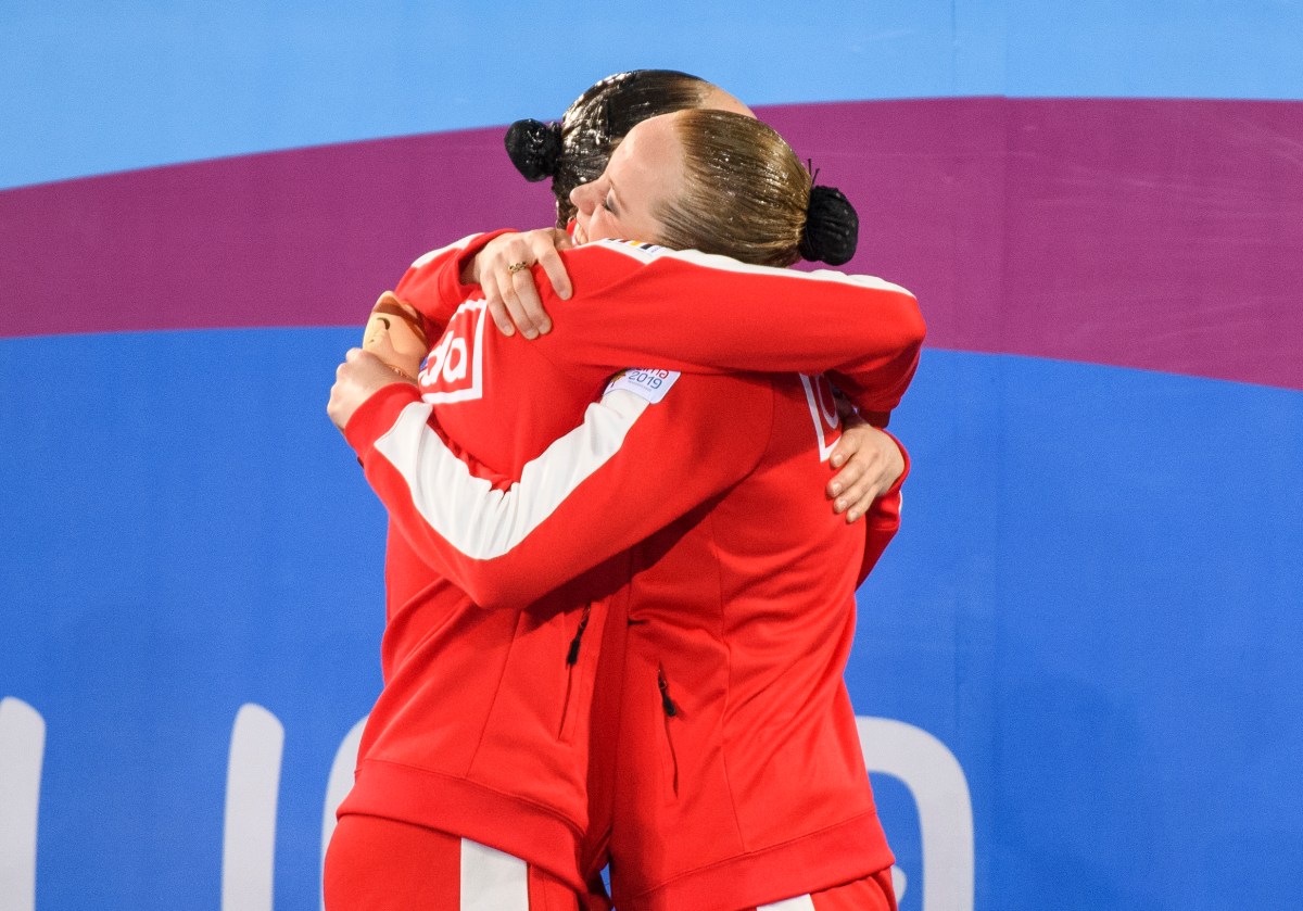 Claudia Holzner and Jacqueline Simoneau hug