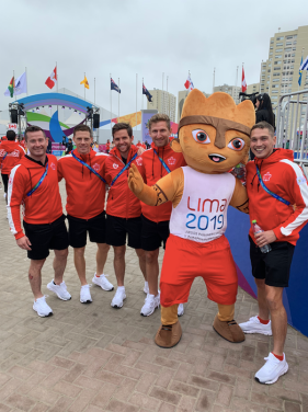 Athletes pose with mascot