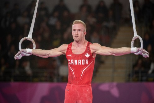 Canadian gymnast hangs on the rings