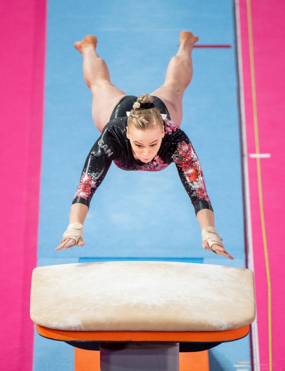 athlete jumps on the vault