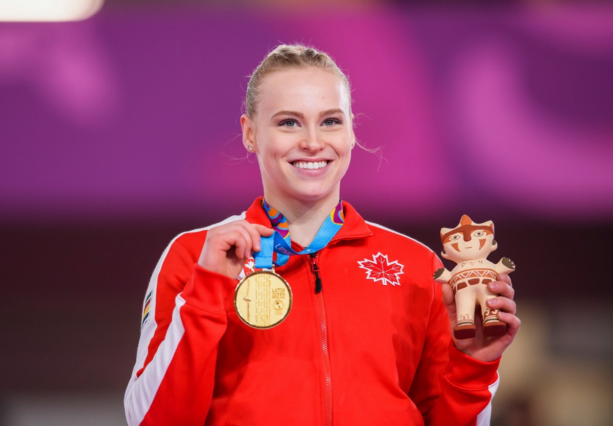 Ellie Poses with her gold at Lima