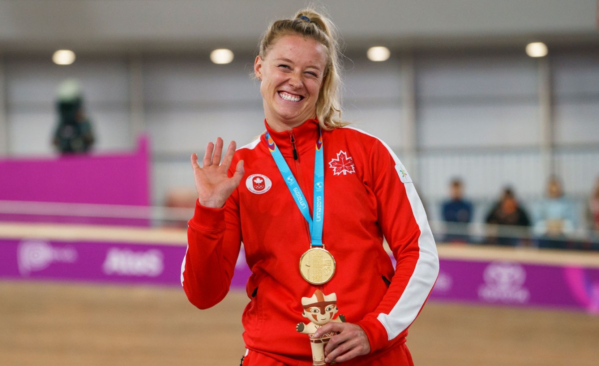 Kelsey Mitchell smiles on the podium after winning Pan Am gold
