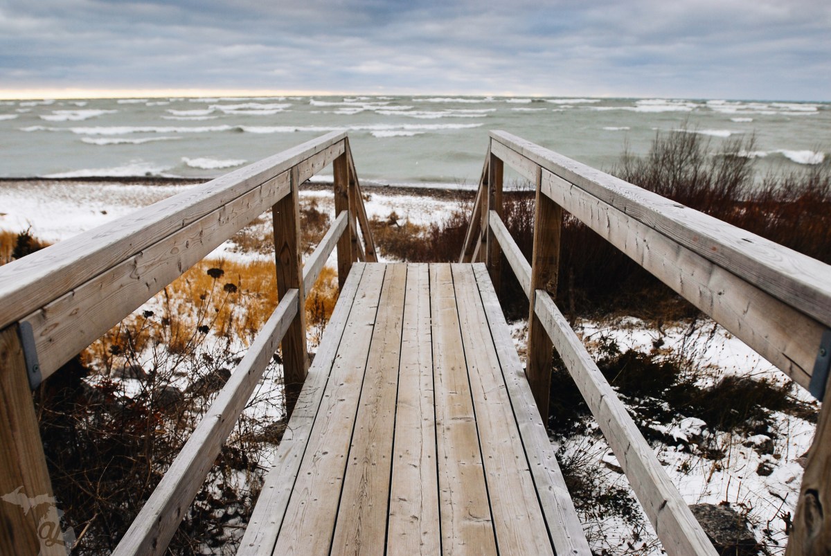 Pier overlooking the beach and waves