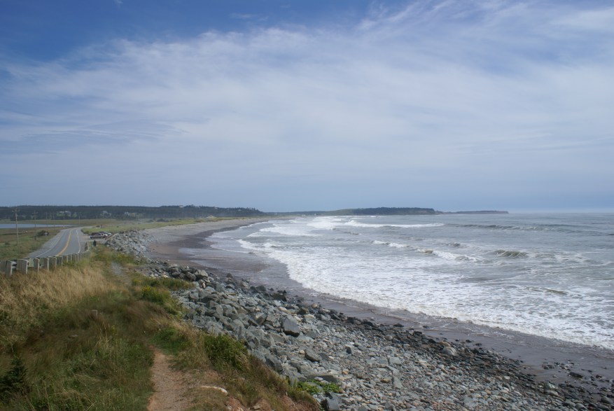 Beach spot with waves and rocky sand