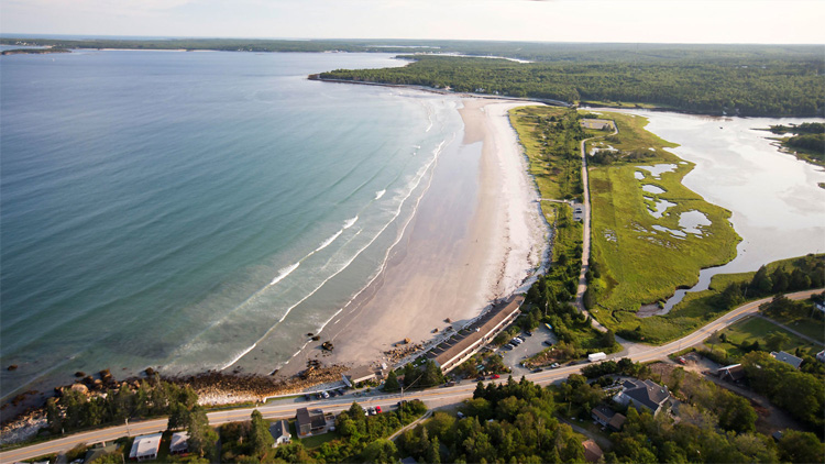 Aerial view of the beach with blue waters