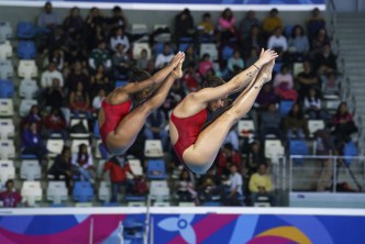 Two divers in mid air