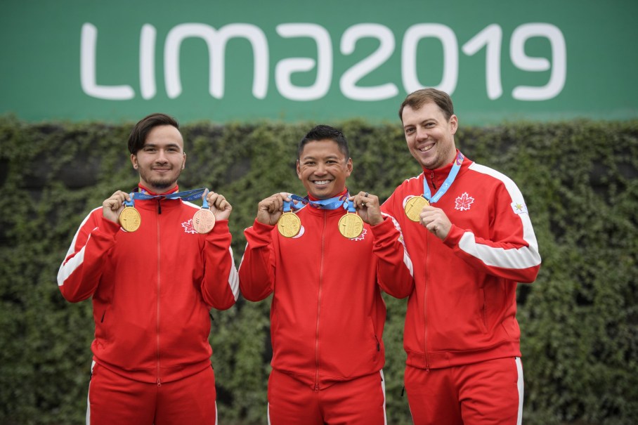 team-canada-archery-lima Three athletes pose with their medals.