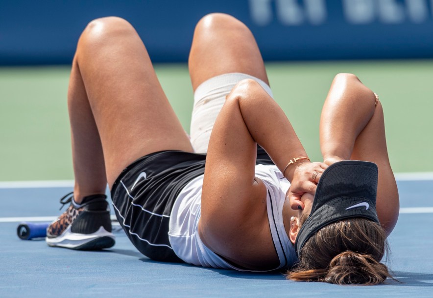Bianca Andreescu lying on the court