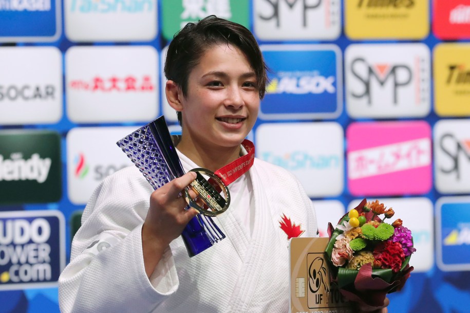 Christa Deguchi poses for a photo with her gold medal from the women's -57 kg weight class at the Judo World Championships