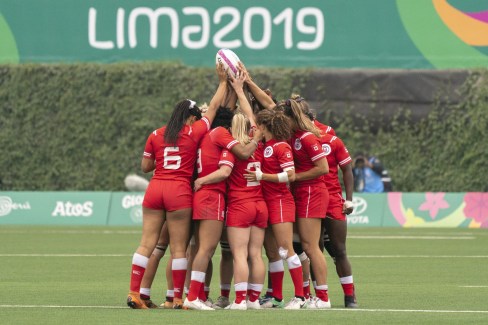 team canada huddles together