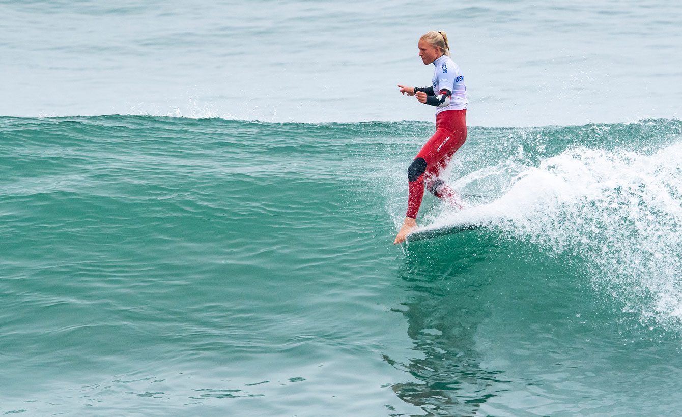 Mathea Olin competes in the women's longboard