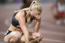 Watson crouches and cover her face after hearing she was disqualified