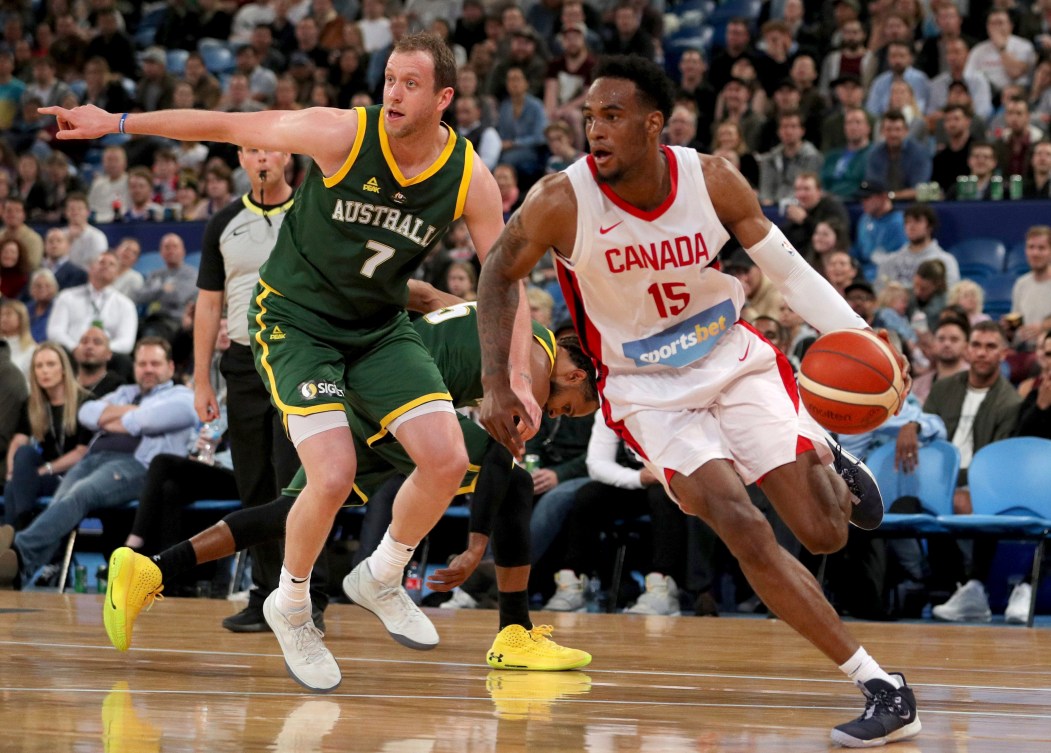 Canada's Oshae Brissett, right, drives past Joe Ingles, of Australia, during an exhibition basketball game in Perth, Australia.