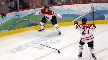 Sidney Crosby celebrates with Scott Niedermayer