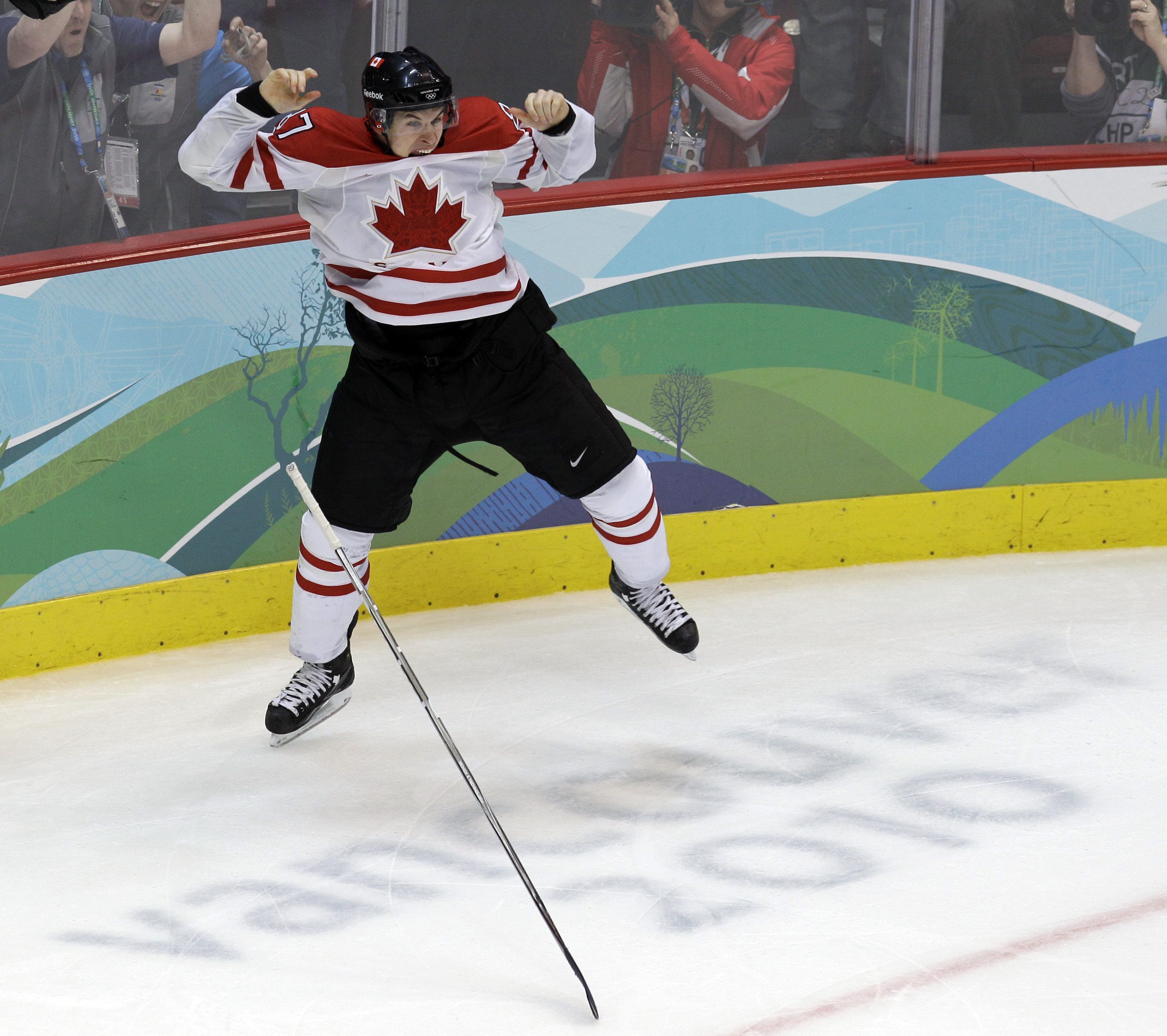 Sidney Crosby's hockey stick falls to the ground as he celebrates his winning goal at the Vancouver 2010 Olympics.