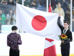 Keegan Messing holds Japanese flag for opponent