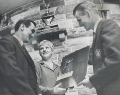 Beverly Boys (middle) is honored with a photograph of her dive at the 1968 Mexico Summer Olympics