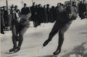 Gordon Audley, right, skates alongside Canadian teammate Frank Stack