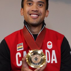 Gilmore Junio poses with his medal