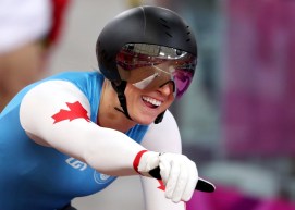 Kelsey Marie Mitchell of Canada celebrates after qualifying for the track cycling women's sprint final.