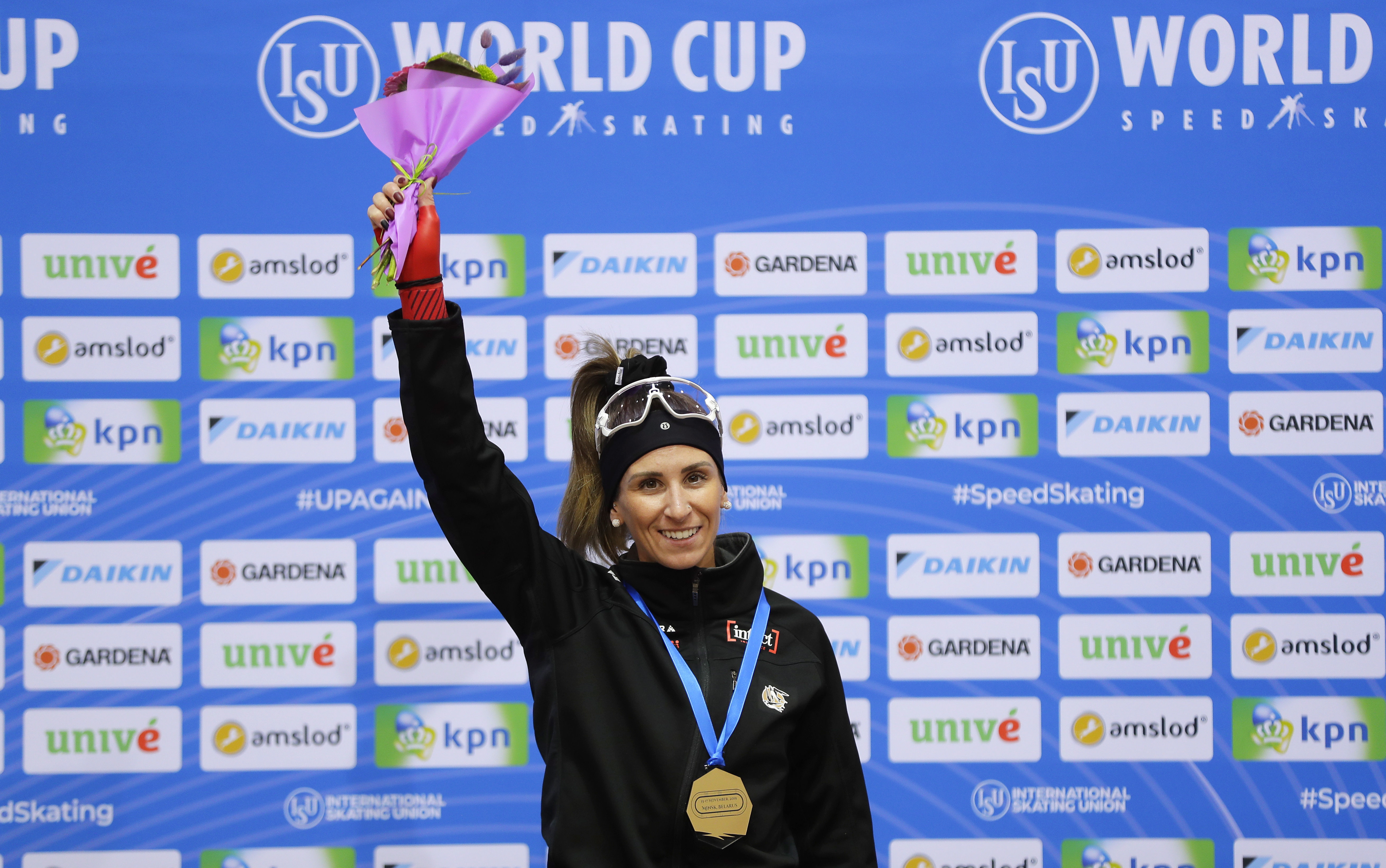 Canada's Ivanie Blondin celebrates on the podium after winning the women's mass start race of the speed skating World Cup at the Minsk ice arena in Minsk, Belarus, Sunday, Nov. 17, 2019. (AP Photo/Sergei Grits)