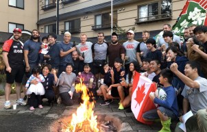 Canada's 2019 Rugby World Cup team poses for a photo with Japanese citizens.