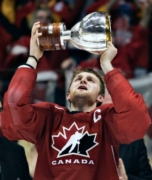 Karl Alzner celebrating with trophy