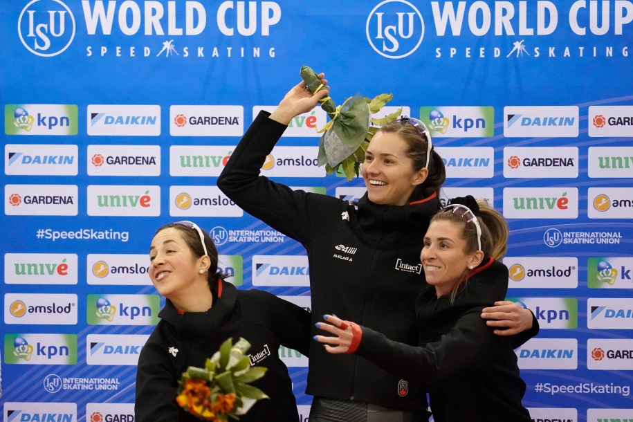 (L-R) Valerie, Isabelle and Ivanie on the podium, laughing at something to the left.