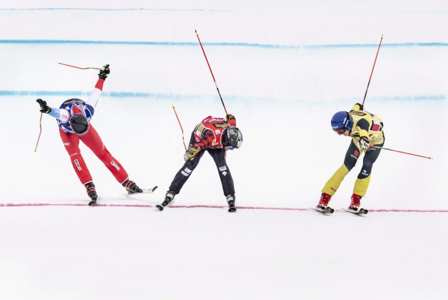 Daniel Bohnacker, yellow, of Germany crosses the finish line to win followed by Kevin Drury, red, of Canada and Ryan Regez, blue, of Switzerland during the FIS World Cup Men's Freestyle Skicross final in Idre, Sweden, on Sunday Jan. 26, 2020. (Pontus Lundahl / TT via AP)