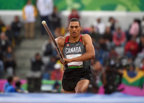 Pierce Lepage competes in pole vaulting