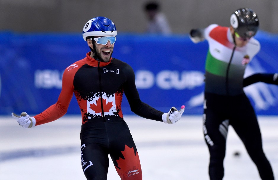Canada's Steven Dubois celebrates as he crosses the finish line of the men's 500 meters race at the World Cup
