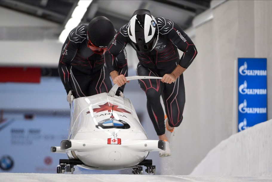 Justin Kripps and Benjamin Coakwell of Canada start their first run of the two-man Bobsled World Cup race