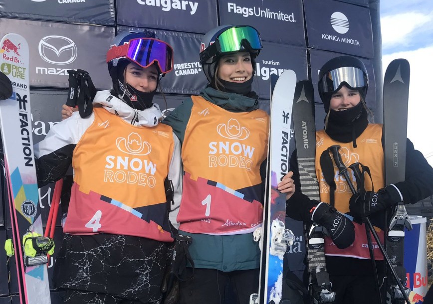 Slopestyle medallists stand on the podium after competing in the women's freestyle skiing event.