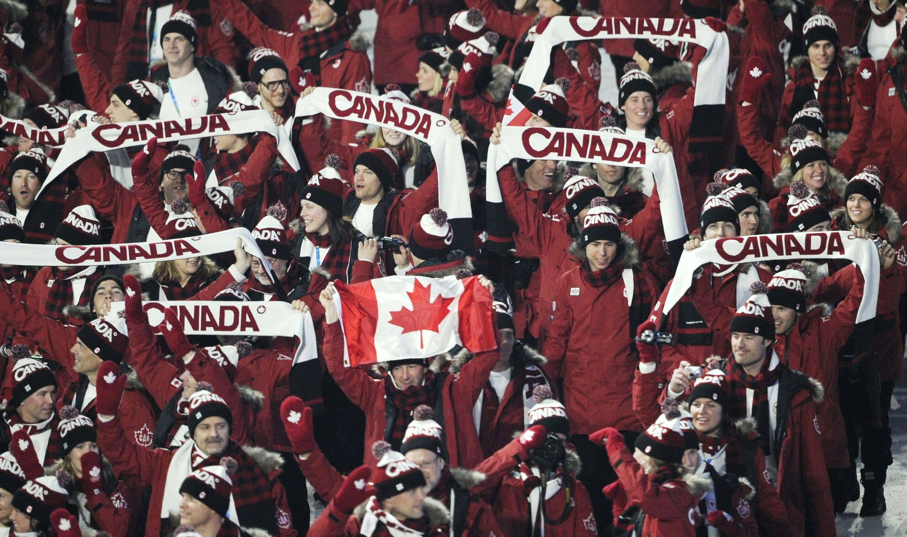 Canada's Clara Hughes carries the flag during the opening ceremony for the Vancouver 2010 Olympics in Vancouver, British Columbia, Friday, Feb. 12, 2010.