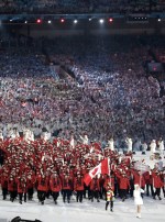 Canada's Clara Hughes carries the flag during the opening ceremony for the Vancouver 2010 Olympics in Vancouver, British Columbia, Friday, Feb. 12, 2010.