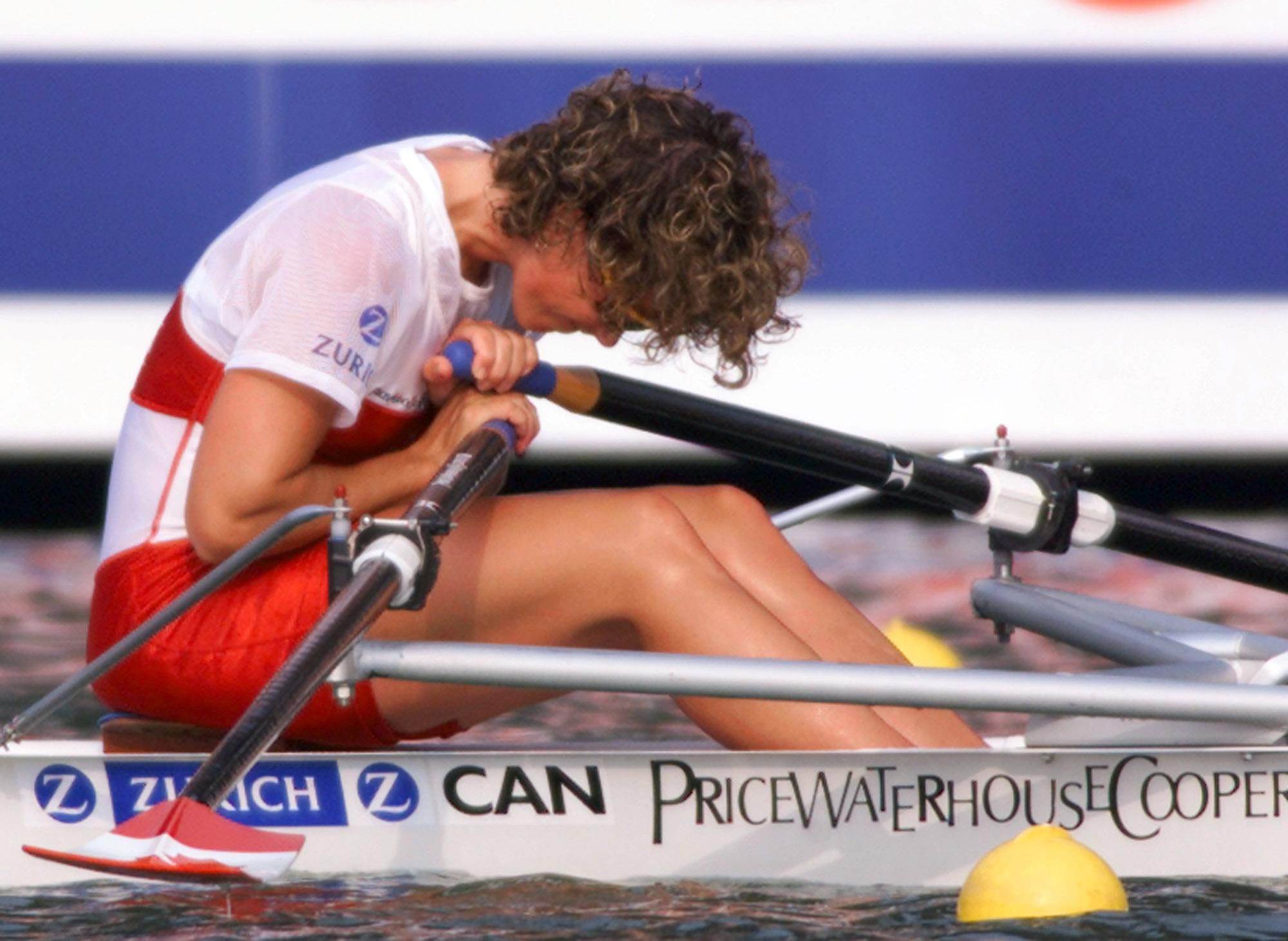 Marnie McBean bent over in her boat