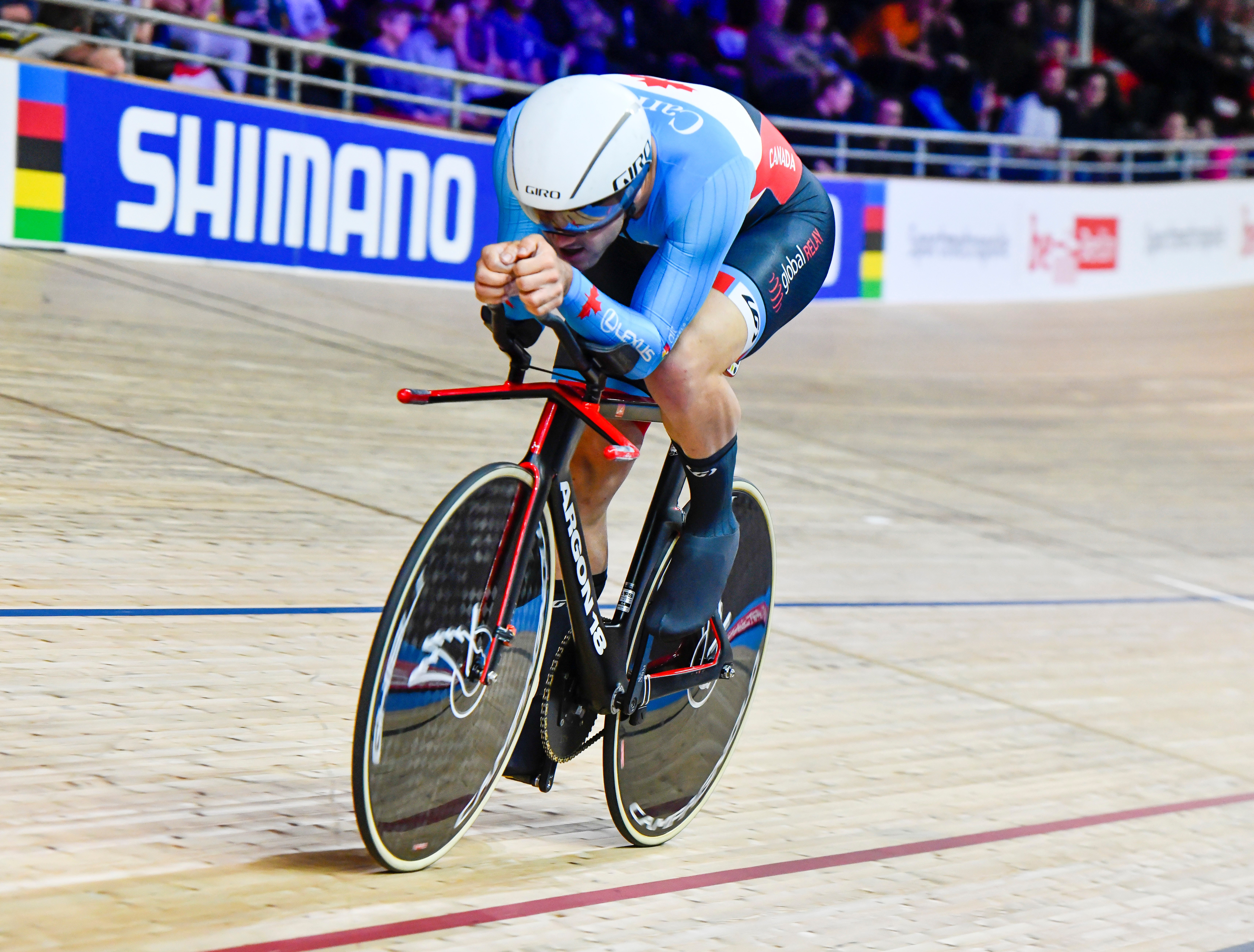 Vincent de Haitre racing on bike in velodrome 