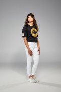 Kylie Masse is facing the camera in Tokyo 2020 closing ceremony t-shirt and jeans