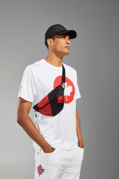 Pierce LePage is facing the camera in Tokyo 2020 Opening ceremony t-shirt and fanny pack