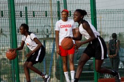 Kayla Alexander plays basketball with girls in Senegal