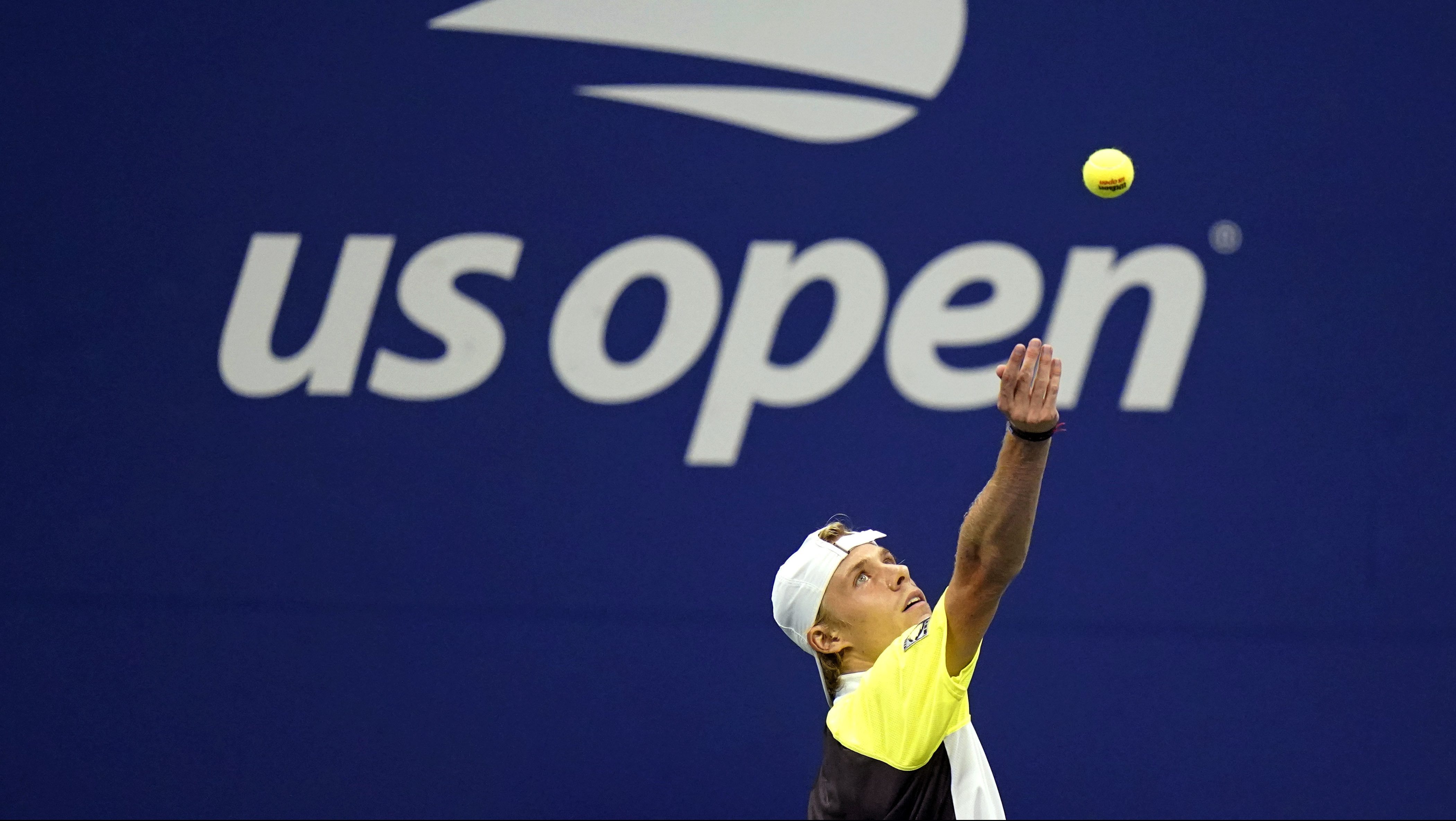 Pablo Carreno Busta, of Spain, Denis Shapovalov, of Canada, serves to Pablo Carreno Busta, of Spain, during the quarterfinal round of the US Open tennis championships, Tuesday, Sept. 8, 2020, in New York. (AP Photo/Frank Franklin II)