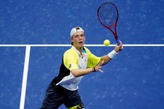 Denis Shapovalov, of Canada, eyes a return to Pablo Carreno Busta, of Spain, during the quarterfinal round of the US Open tennis championships, Tuesday, Sept. 8, 2020, in New York. (AP Photo/Frank Franklin II)