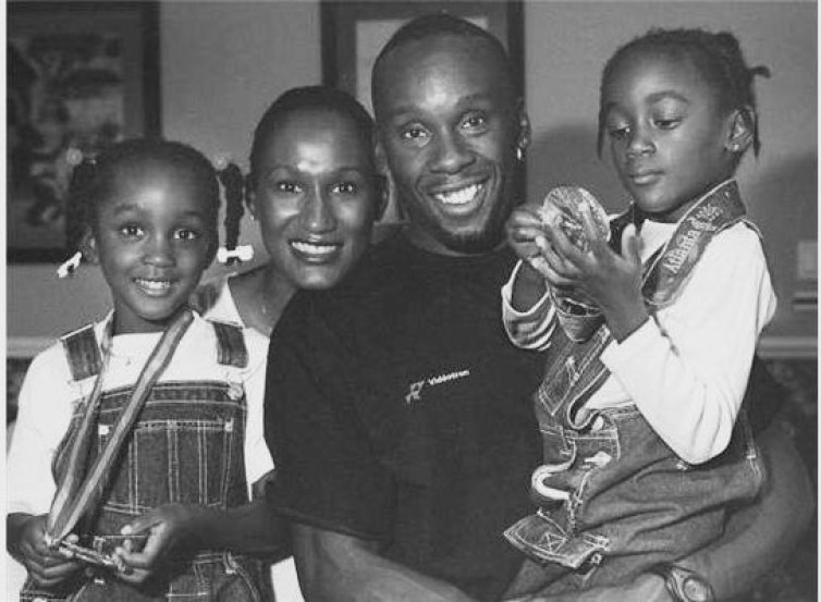 Bruny Surin Bruny Surin and his young daughters wearing his medals