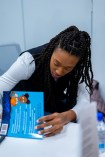 Kayla Alexander signing her book