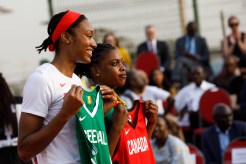 Kayla Alexander poses with a Senegal basketball jersey