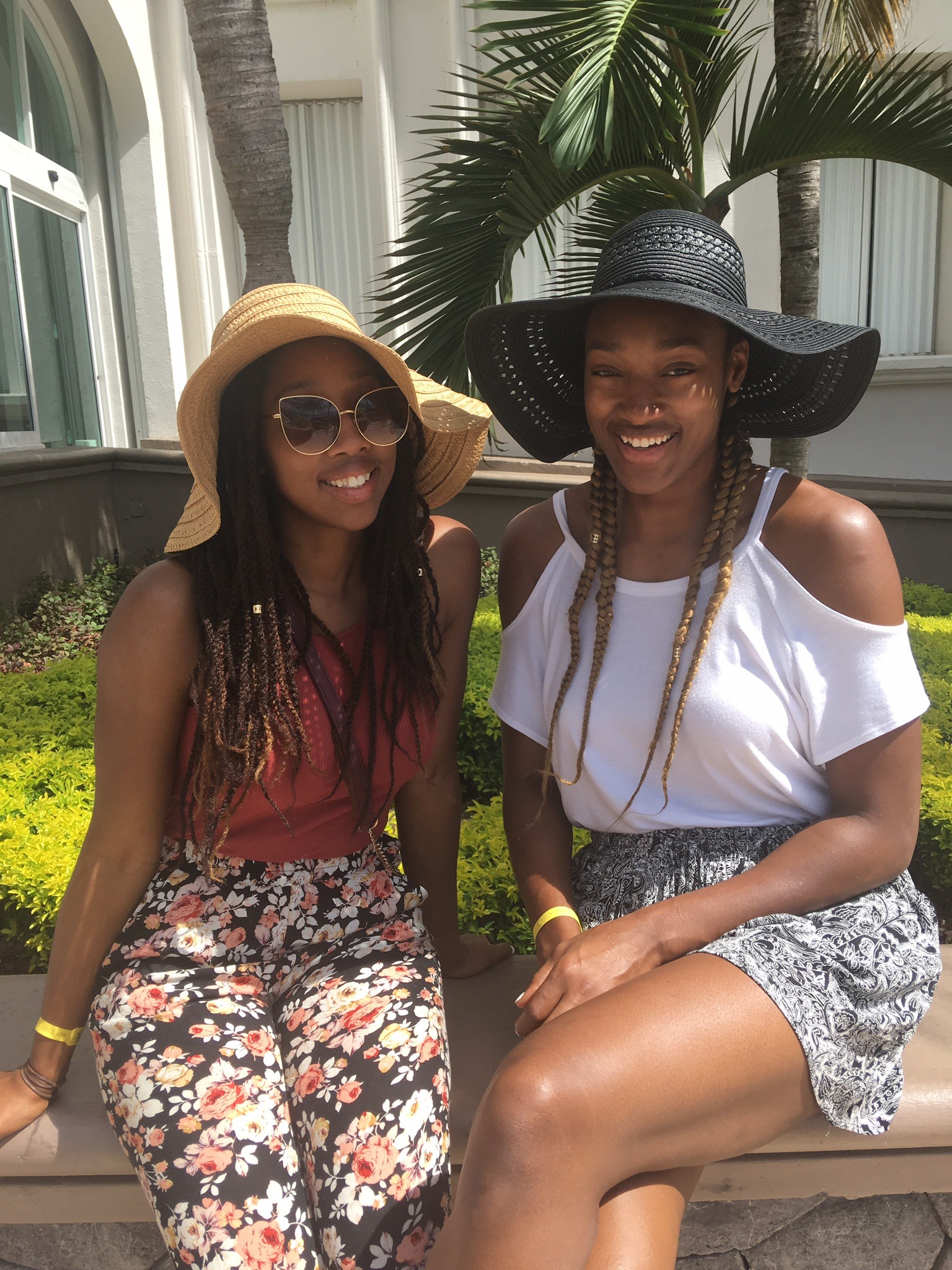 Kayla and Kesia Alexander sitting outside