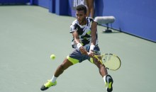 US Open Tennis Felix Auger-Aliassime, of Canada, returns a shot to Thiago Monteiro, of Brazil, during the first round of the US Open tennis championships, Tuesday, Sept. 1, 2020, in New York. (AP Photo/Seth Wenig)