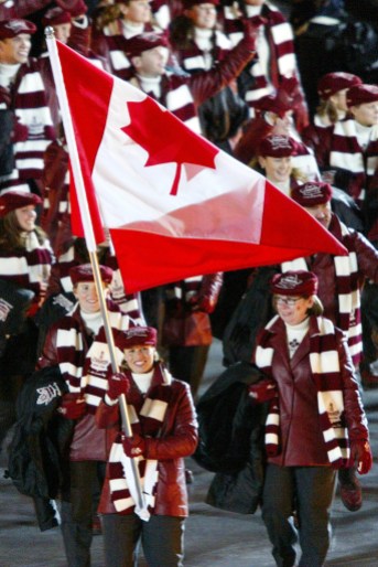 LE MAY DOAN REHORICK Catriona Le May Doan carries the Canadian flag in front of Team Canada
