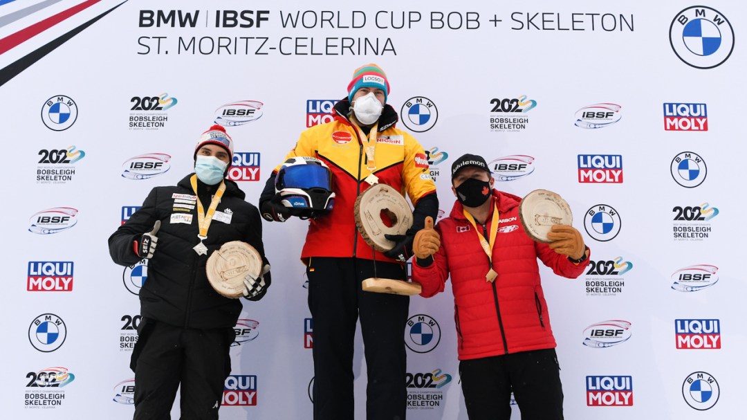 Justin Kripps stands on third step of the podium as the team of Justin Kripps, Ryan Sommer, Ben Coakwell and Cam Stones won a four-man bobsleigh bronze medal at the World Cup on Sunday January 17, 2021 in St. Moritz, Switzerland. (Photo by: IBSF/Viesturs Lacis)
