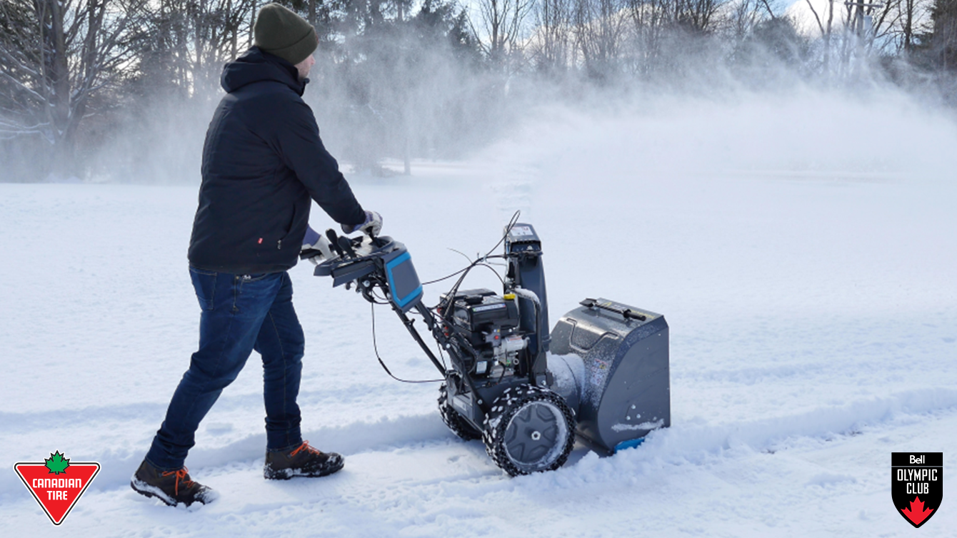 A person pushing a snowblower